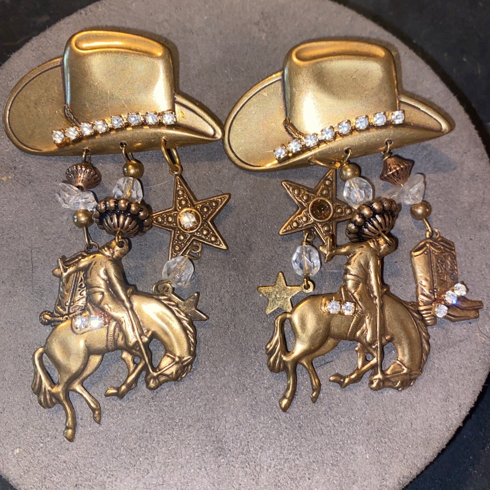 Rhinestone cowgirl earrings. With bronco and boots. They are 3 inches in length.